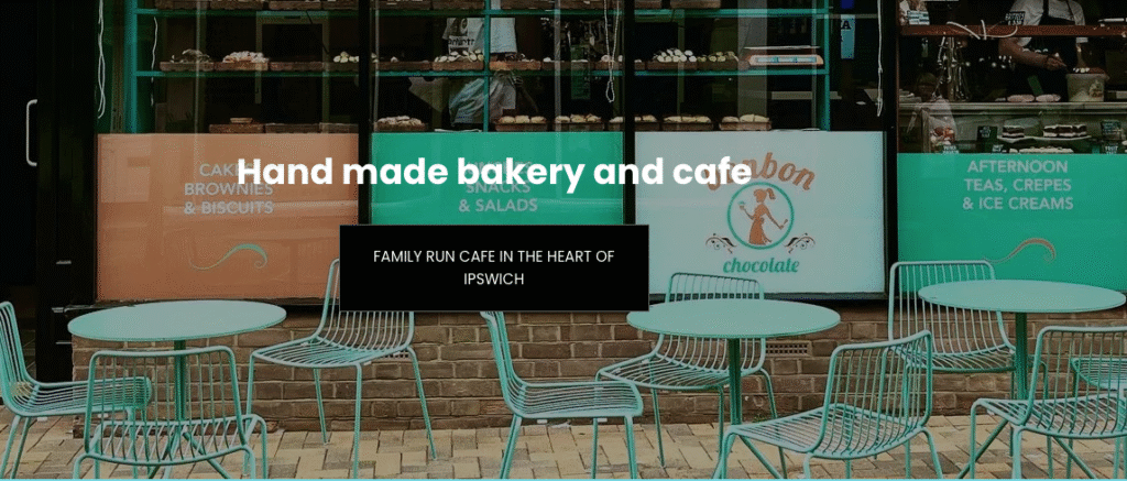 Outdoor shot of BonBon cafe with chairs and tables outside. Perspective is looking towards the cafe