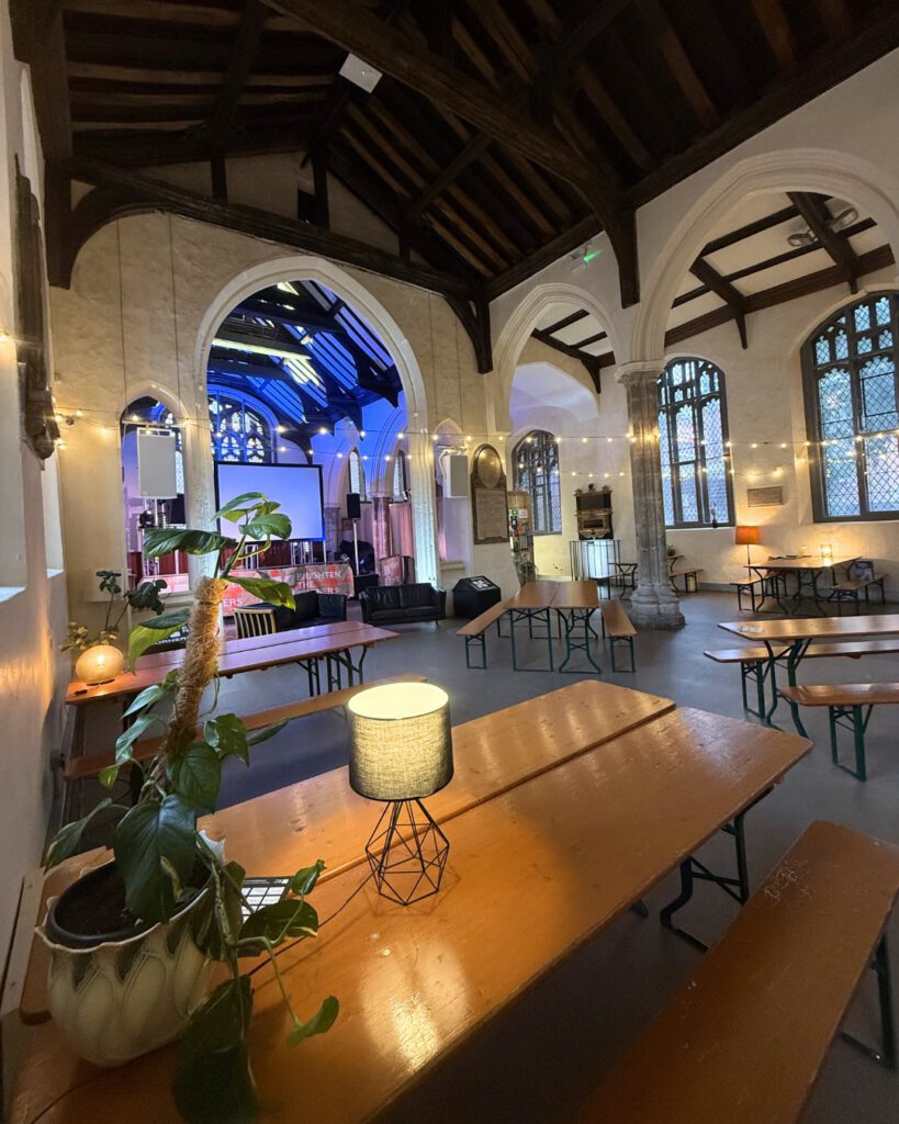 inside of The Church, St Stephen's Lane, Ipswich with tables, lighting plants decorating